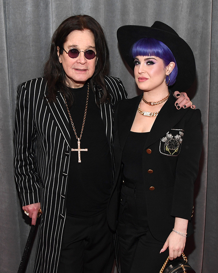 Ozzy Osbourne and Kelly Osbourne pose together at an event, highlighting fans' attention on Kelly's transformation.