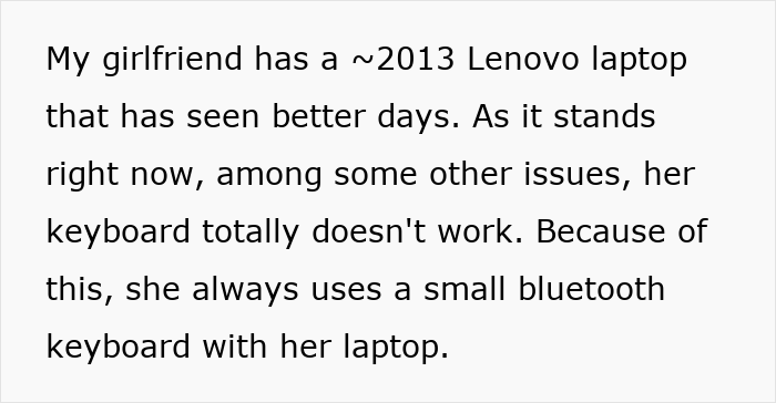 Old Lenovo laptop with broken keyboard, showing a user relying on a spare Bluetooth keyboard for typing. Old Lenovo laptop with broken keyboard, showing a user relying on a spare Bluetooth keyboard for typing.