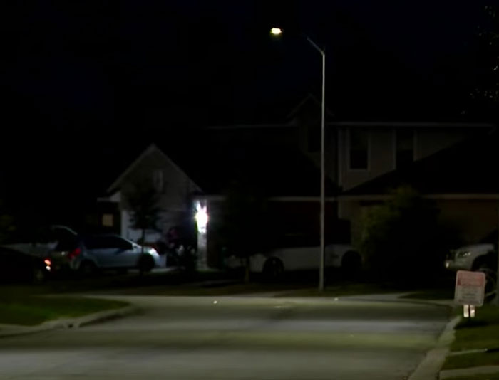 Dark suburban street at night with houses and parked cars, related to Texas dad rescuing kidnapped daughter. Dark suburban street at night with houses and parked cars, related to Texas dad rescuing kidnapped daughter.