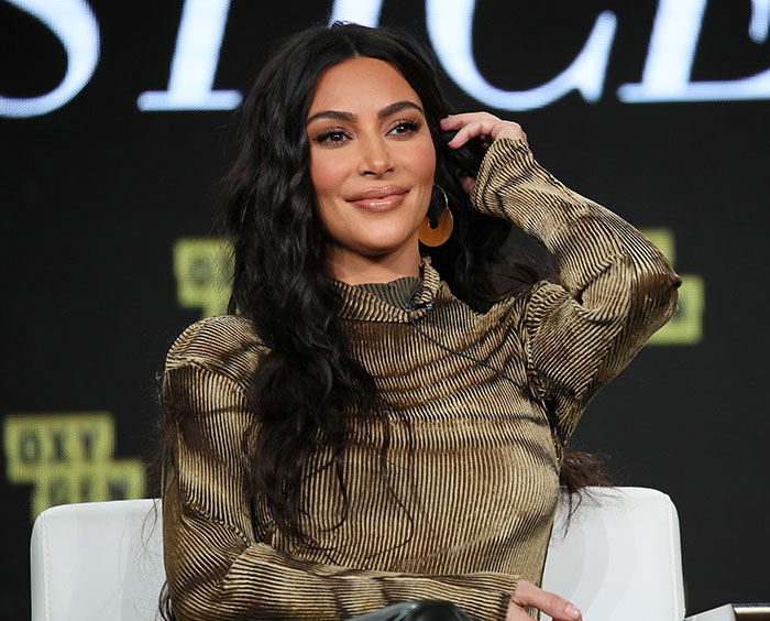 Kim Kardashian smiling during a panel discussion, reflecting on her struggle with low brain activity after scan results. Kim Kardashian smiling during a panel discussion, reflecting on her struggle with low brain activity after scan results.