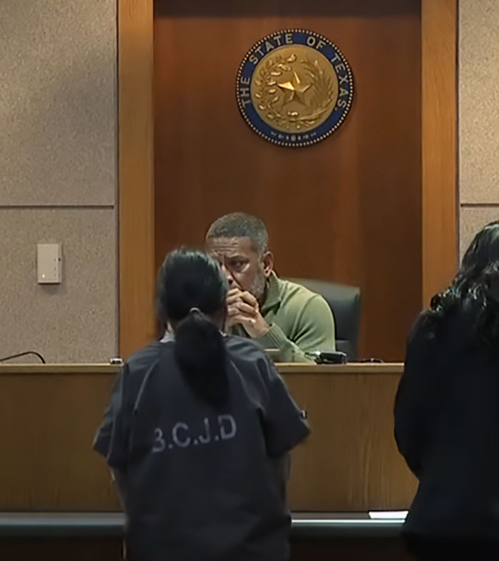 Judge in courtroom delivering harsh lesson to teen after pepper-spraying tourists on a boat case hearing.