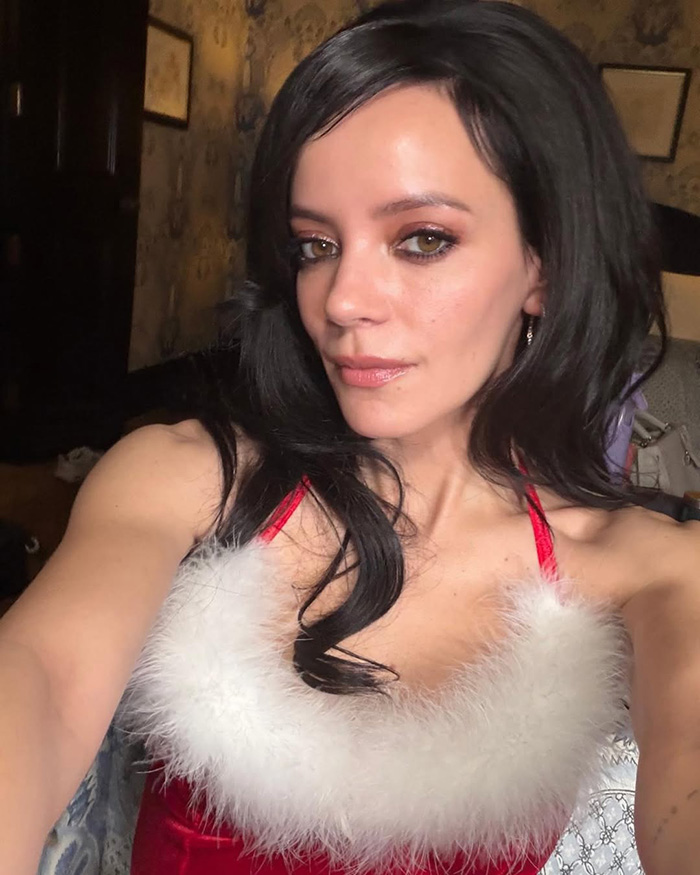 Lily Allen in a red and white dress, embracing a continual divorce celebration during her revenge era. Lily Allen in a red and white dress, embracing a continual divorce celebration during her revenge era.