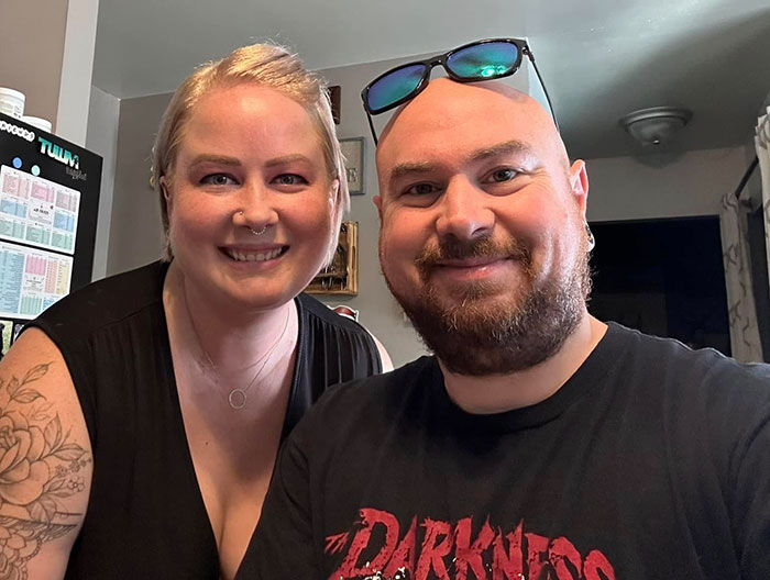 Two people smiling indoors, unrelated to DoorDasher arrest involving pepper-spraying incident and bizarre excuse.