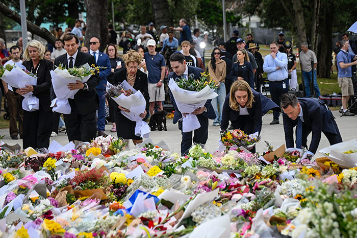 People laying flowers at a memorial, honoring the woman who took a bullet for a 3-year-old during Bondi Beach attack. People laying flowers at a memorial, honoring the woman who took a bullet for a 3-year-old during Bondi Beach attack.