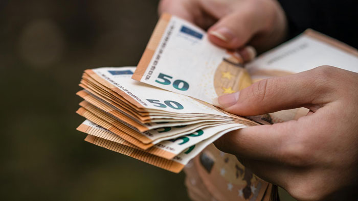 Hands counting 50 euro banknotes, representing a lady refusing to help cruel parents who abandoned her. Hands counting 50 euro banknotes, representing a lady refusing to help cruel parents who abandoned her.