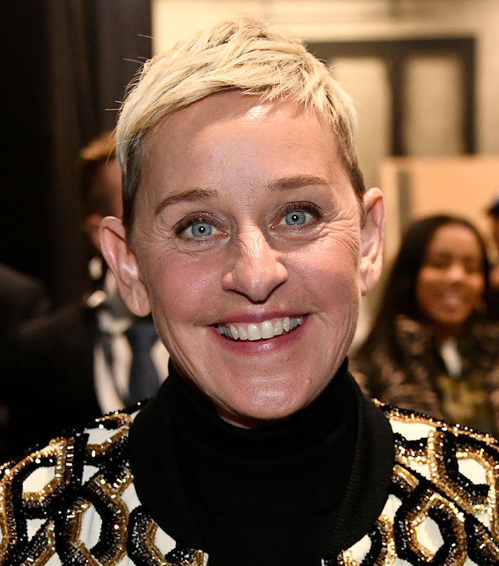 Smiling celebrity with short blonde hair at an event, representing the most disliked celebrities of 2025.