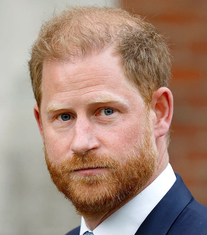 Close-up of a red-haired man in a suit, representing one of the most disliked celebrities of 2025 in public opinion.