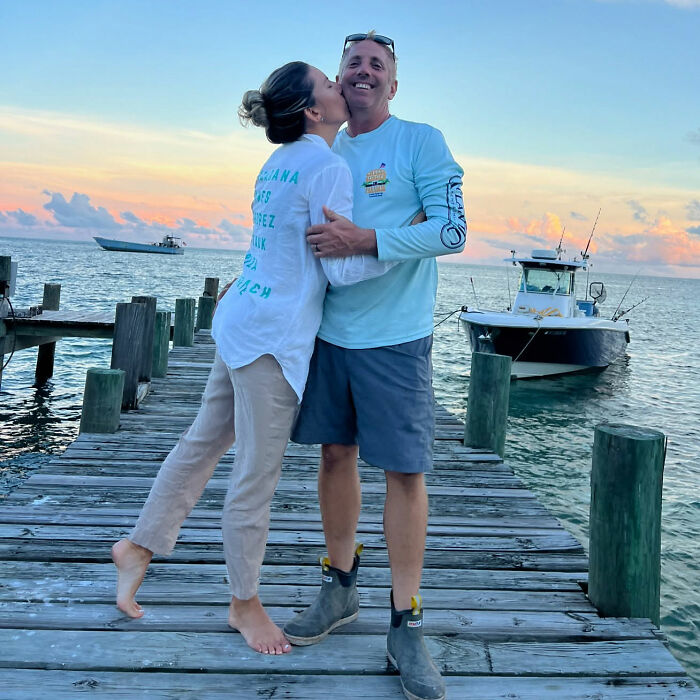 Greg Biffle's wife kissing him on a dock near boats at sunset, moments before a horrific plane crash.