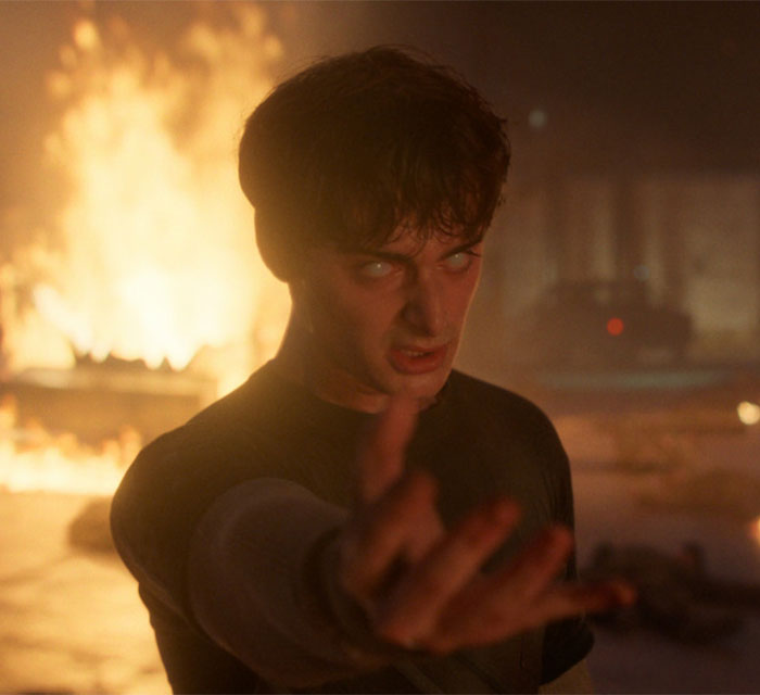 Noah Schnapp acting in intense Stranger Things scene with fiery background during new season performance.