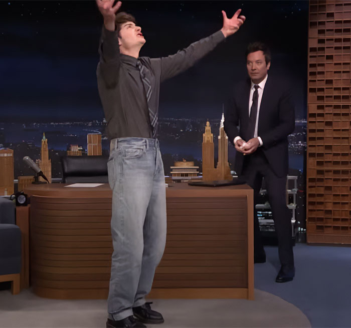 Noah Schnapp recreating a scene with expressive gestures during a talk show appearance for Stranger Things season.