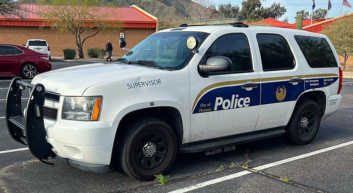 Phoenix police supervisor vehicle parked outside with mountains and buildings in the background during daytime Phoenix police supervisor vehicle parked outside with mountains and buildings in the background during daytime