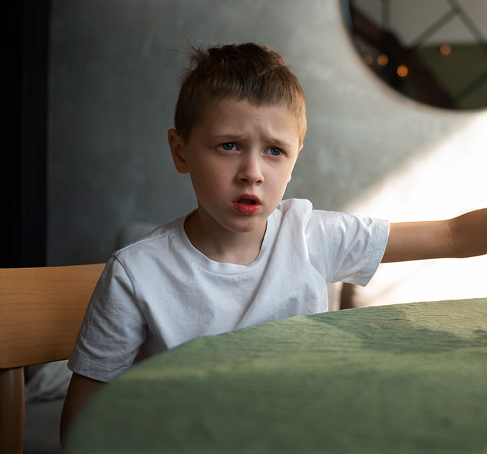 Young boy looking upset and frustrated, illustrating moments parents realized their kids are selfish and unloving sociopaths