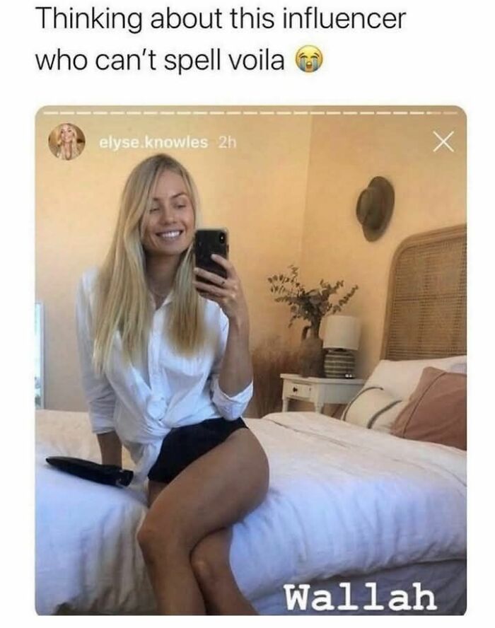 Influencer sitting on bed smiling, taking mirror selfie, with text about funny spelling fail and watching stupidity fail.