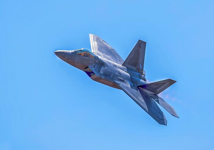 Stealth fighter jet soaring through a clear blue sky, evoking memories of scary moments people still talk about.