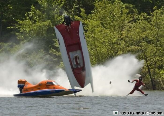 Hydroplane boat flipping in midair with driver ejecting and running on water, a perfectly timed photo capturing the action.