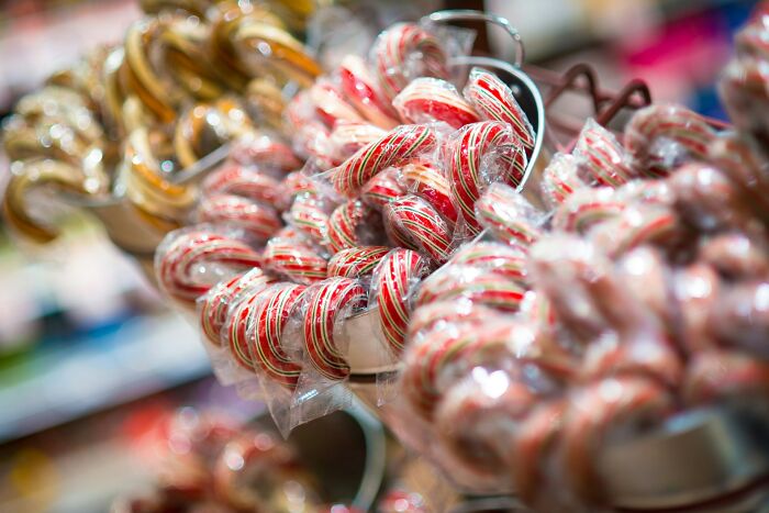 Close-up of tightly packed candy canes highlighting small design mistakes in product arrangement and display.
