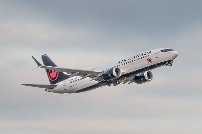 Air Canada airplane taking off at the airport, illustrating one of the crazy airport stories hard to believe.