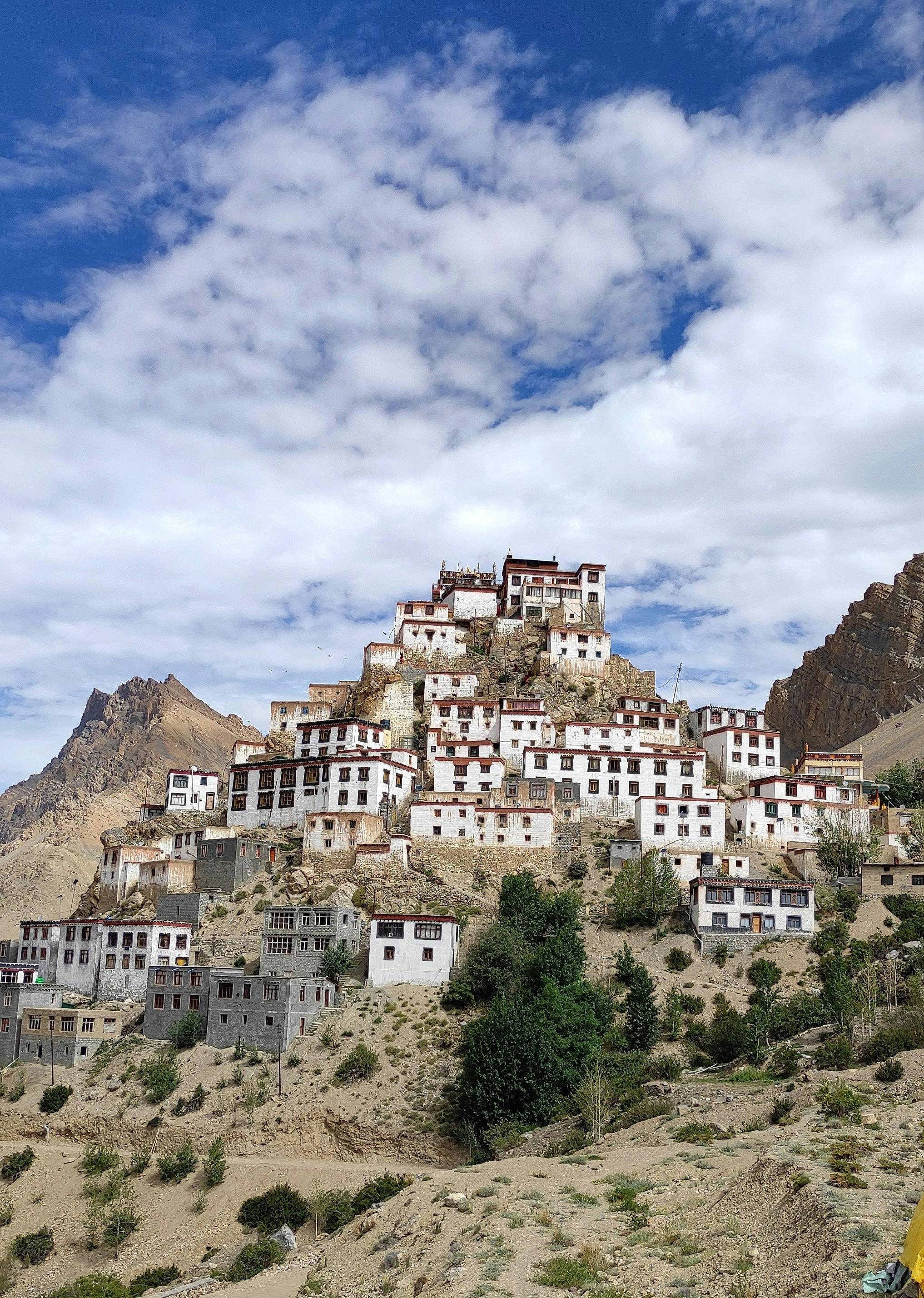 Ancient monastery perched on rocky hills in Himachal Pradesh, surrounded by mountains and nature’s finest wonders.