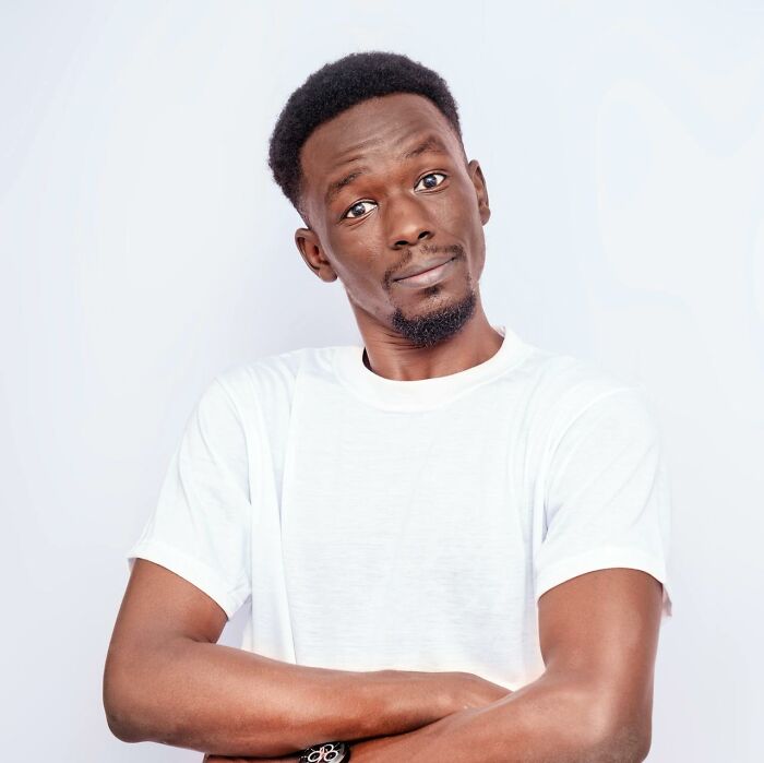 Young man in a white shirt with a clever and sassy expression, embodying funny things said in the heat of the moment.