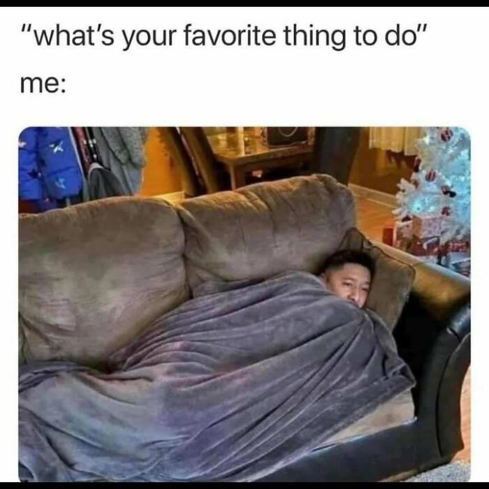 Person wrapped in a blanket on a couch relaxing, featured in 120 hilarious memes that make you forget stress.