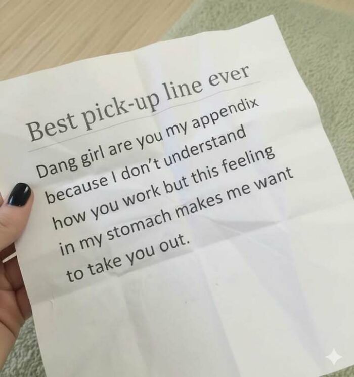 Hand holding paper with humorous pick-up line, part of hilarious memes to help you forget what you were stressed about.