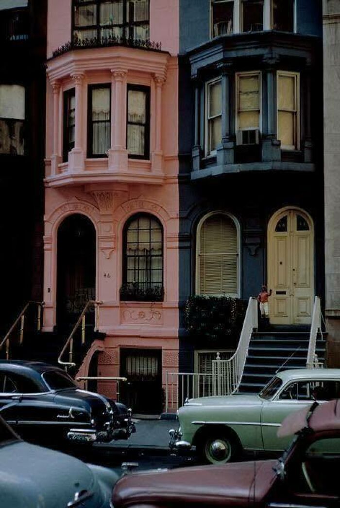 Historic classic buildings with vintage cars parked on street, capturing an iconic and beautiful historical scene.