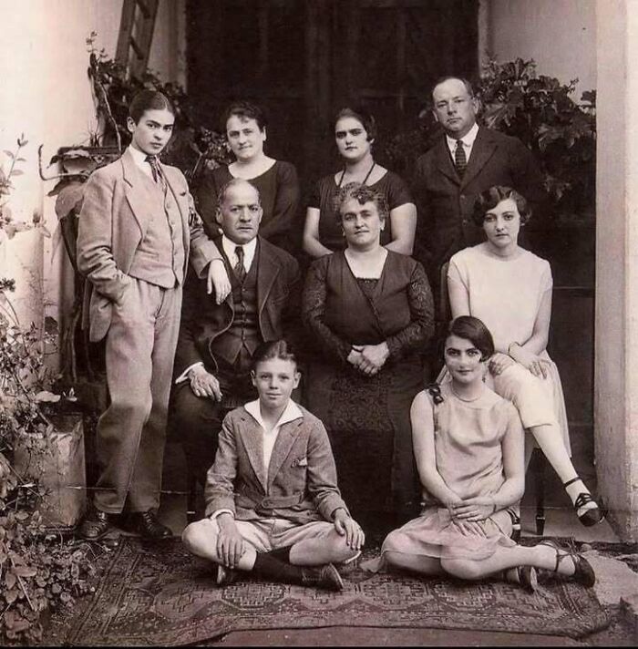 Vintage black and white historical picture showing a group of people posing together, a classic iconic moment captured.