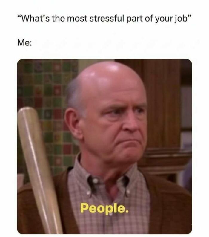 Man holding a bat with a serious face captioned about the most stressful part of job, highlighting hilarious memes and stress relief.