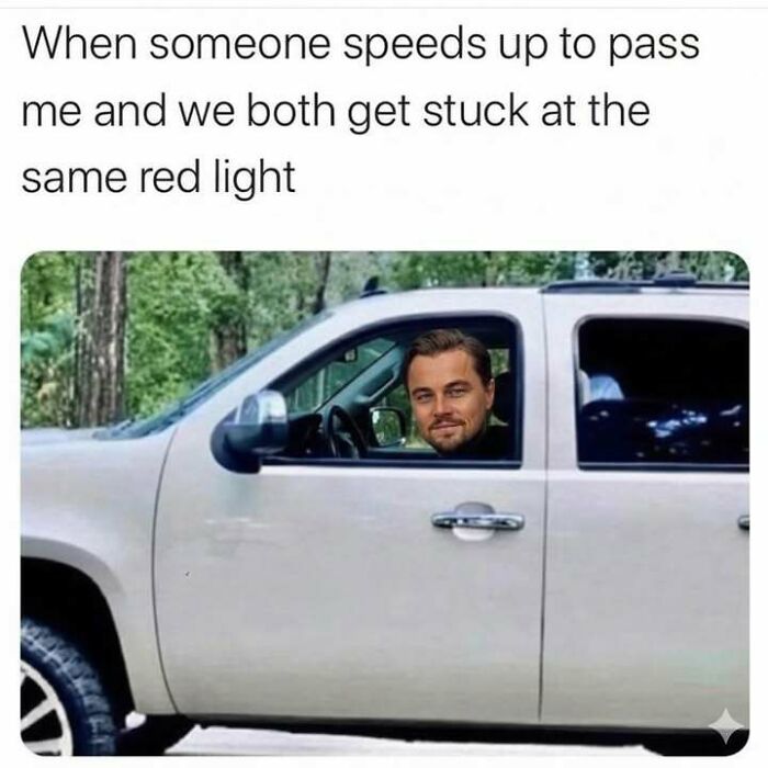 Man with a smirking face edited into a car window, caption about getting stuck at a red light after speeding up to pass.