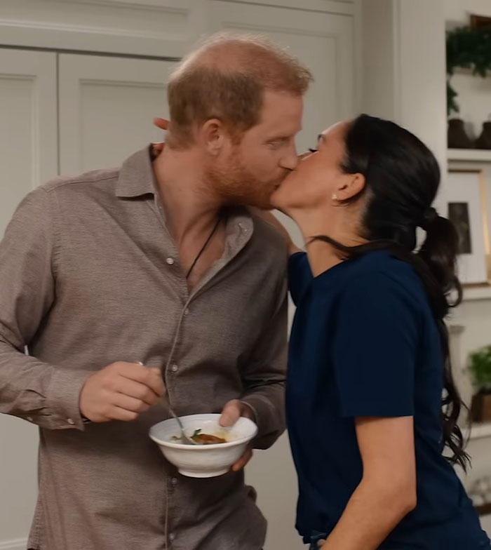 Prince Harry and Meghan Markle sharing a kiss indoors, amid rumors sparked by Meghan Markle's Christmas message. Prince Harry and Meghan Markle sharing a kiss indoors, amid rumors sparked by Meghan Markle's Christmas message.