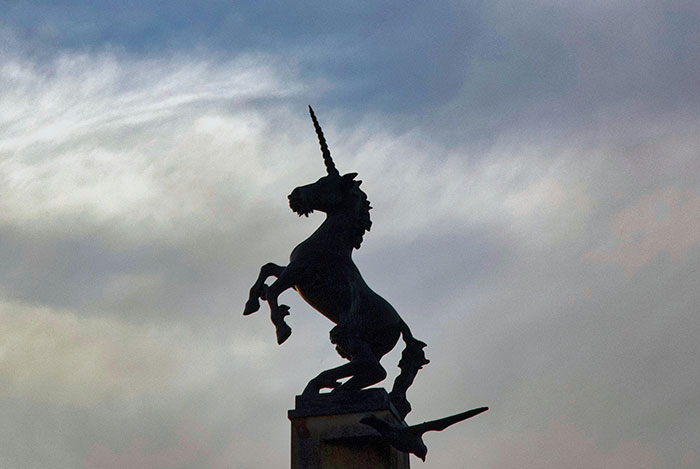 Silhouette of a unicorn statue against a cloudy sky, illustrating truly random facts better than the news.