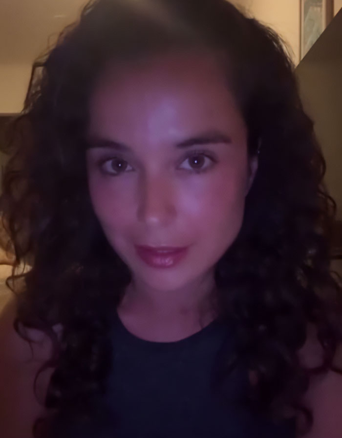 Swimwear model with curly hair taking a low-light selfie, sparking outrage with tone deaf posts after Bondi Beach attack. Swimwear model with curly hair taking a low-light selfie, sparking outrage with tone deaf posts after Bondi Beach attack.