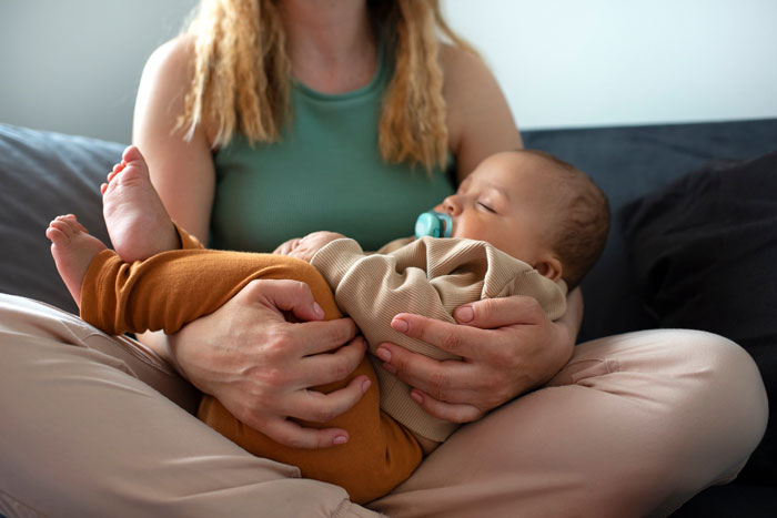 Woman gently holding her granddaughter, illustrating a moment related to refuse taking care granddaughter free concerns. Woman gently holding her granddaughter, illustrating a moment related to refuse taking care granddaughter free concerns.
