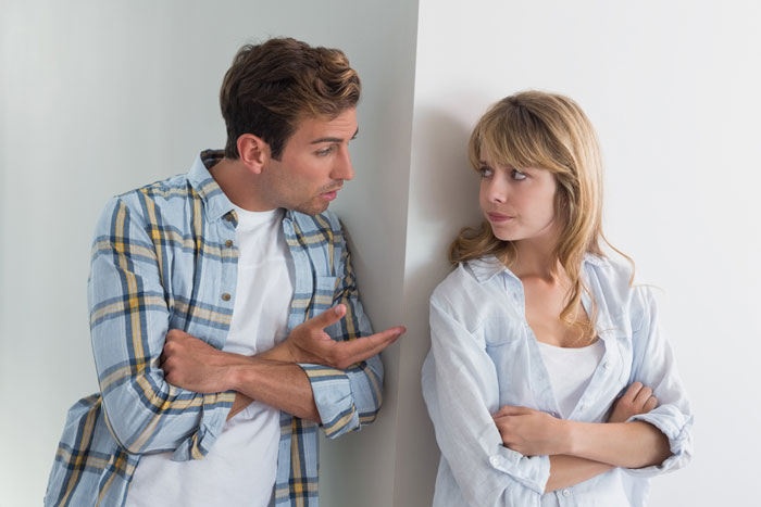 A man and woman in casual clothes having a tense conversation about refusing to establish relationship with fathers and kids. A man and woman in casual clothes having a tense conversation about refusing to establish relationship with fathers and kids.