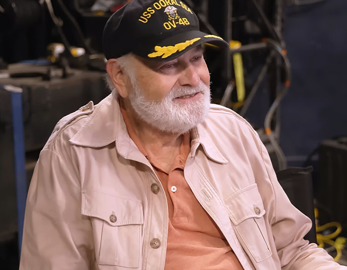 Elderly man wearing USS OORAL seal hat and beige jacket, son eyed as person of interest in LA home slaying case. Elderly man wearing USS OORAL seal hat and beige jacket, son eyed as person of interest in LA home slaying case.