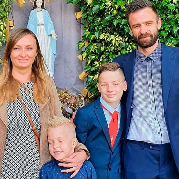 Family of schoolboy, 12, posing outdoors near religious statue as investigation reveals details of Squid Game prank incident. Family of schoolboy, 12, posing outdoors near religious statue as investigation reveals details of Squid Game prank incident.