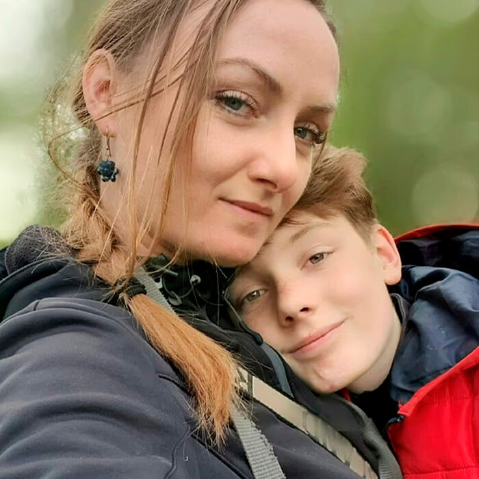 Woman and schoolboy, 12, hugging outdoors with green background, related to investigation about Squid Game prank incident. Woman and schoolboy, 12, hugging outdoors with green background, related to investigation about Squid Game prank incident.