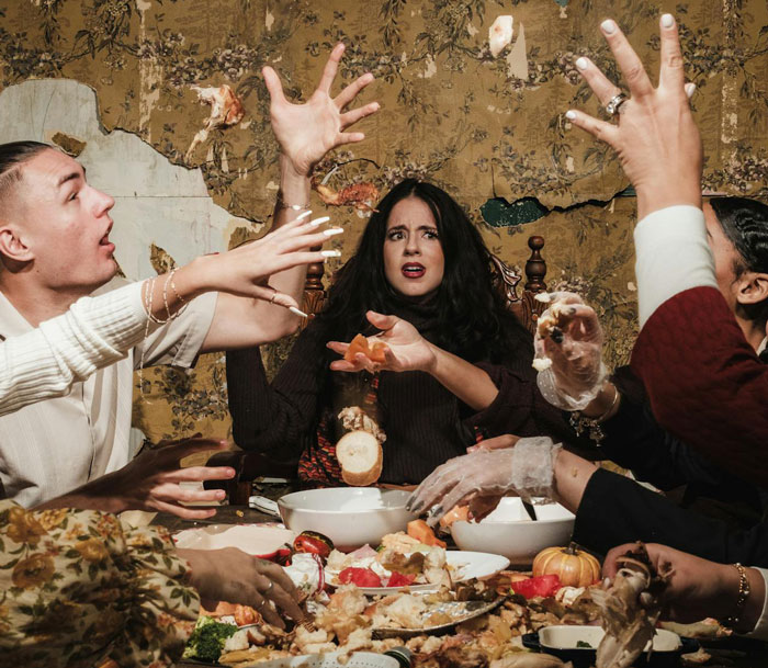 Group at chaotic Thanksgiving dinner, sister’s barefoot spiritual advisor causing commotion and distress around the table