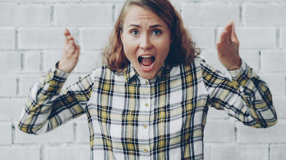 Woman expressing frustration and shock, reacting to entitled behavior while trying to help her brother and his wife