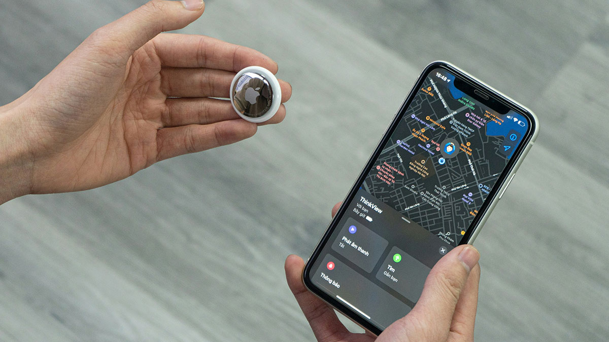 Person holding a tracking device and smartphone showing a detailed map, illustrating clever tactics used by wiliest criminals.