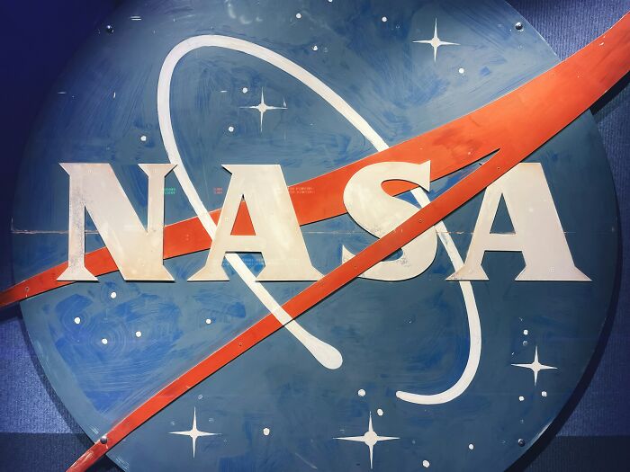 NASA logo against a dark blue background with stars, illustrating the story of most likely to succeed plot twists.