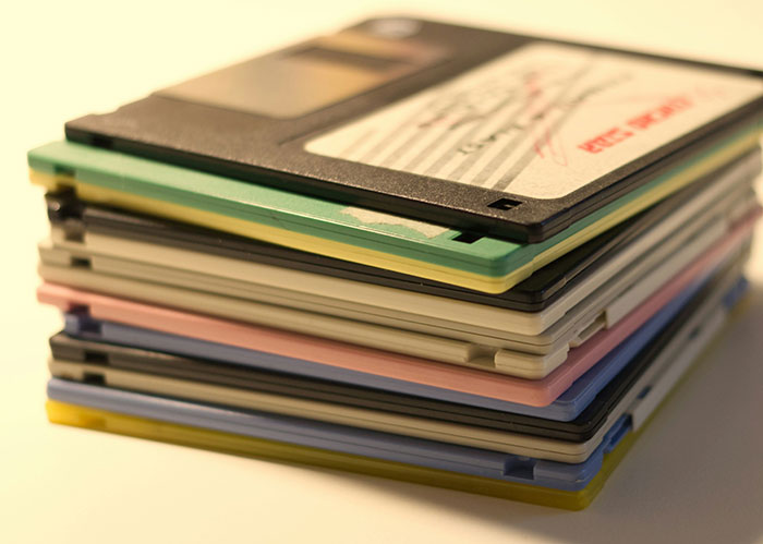 Stack of colorful floppy disks representing retro data storage for diabolical revenge stories and unexpected enemies.