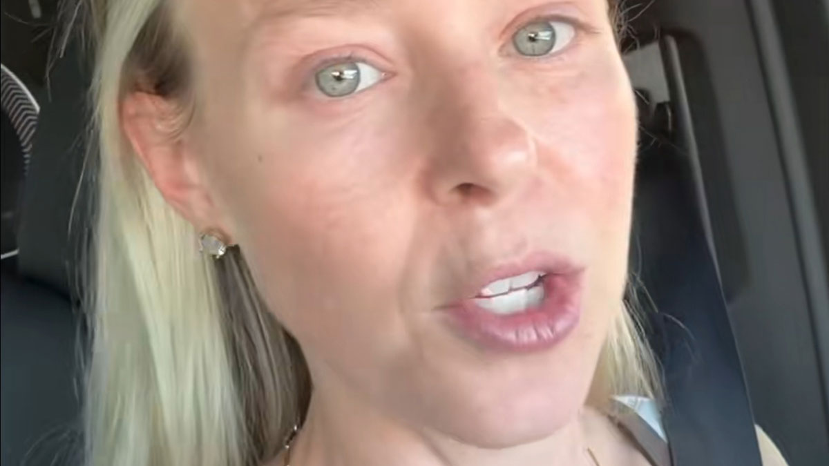 Close-up of a concerned SAHM woman in a car, expressing distress about unexpected divorce and life challenges.