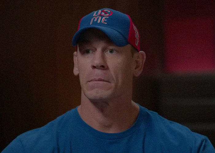 Man wearing a blue and red cap and shirt, featuring a moment from people talking about celebrities and the vibes they gave off.