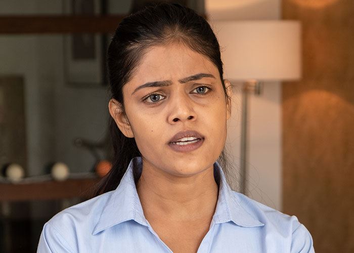 Woman looking frustrated and rethinking relationship after boyfriend salts entire pot of chili in a home kitchen setting Woman looking frustrated and rethinking relationship after boyfriend salts entire pot of chili in a home kitchen setting