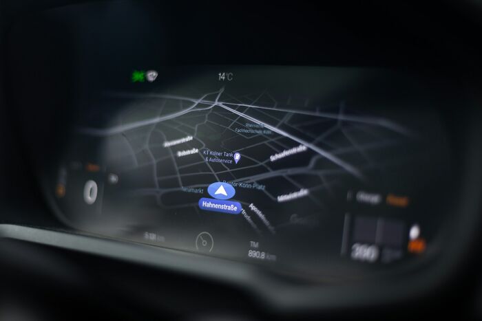 Car navigation system displaying a map at night, illustrating secrets people trust strangers online with safely.