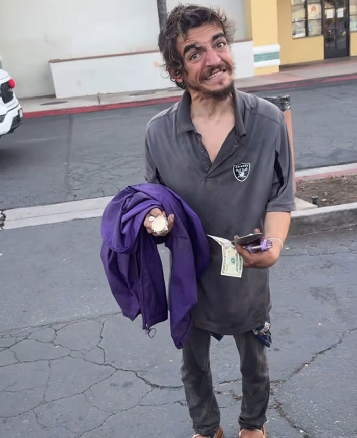 Man holding a purple jacket and cash on a c*****d street, related to Tylor Chase’s hospitalization aftermath and friend’s revelation. Man holding a purple jacket and cash on a c*****d street, related to Tylor Chase’s hospitalization aftermath and friend’s revelation.