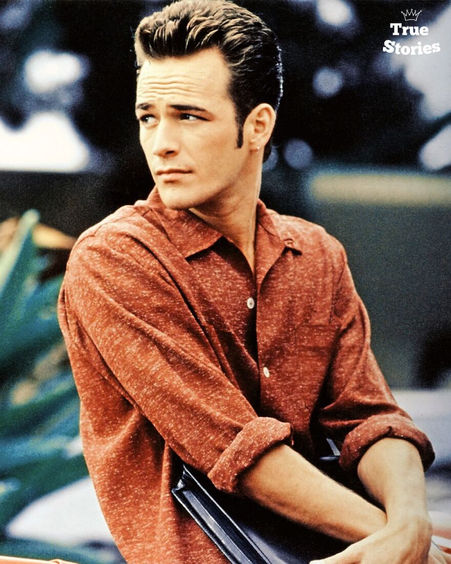 Young American personality in a casual red shirt sitting outdoors, representing important American personalities in a thoughtful pose.