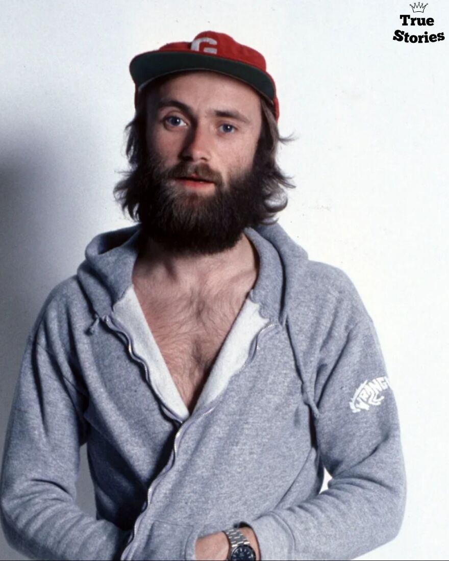 Bearded man in a red cap and gray hoodie posing for a portrait of important American personalities.
