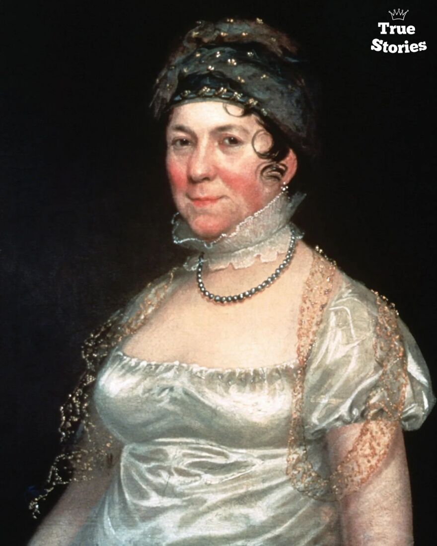 Portrait of an important American personality from history, wearing a satin dress with lace details and a headpiece.
